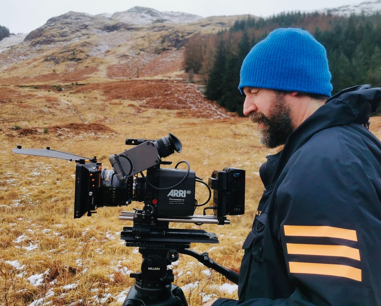 Keith Ingram operating an ARRI camera on a snowy Scottish Highlands location