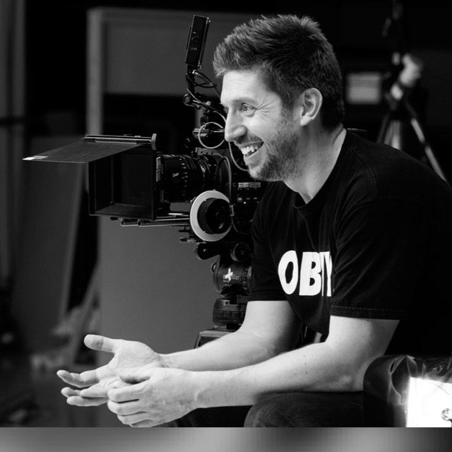 Keith Ingram, Director of Photography, on set behind a cinema camera in Scotland