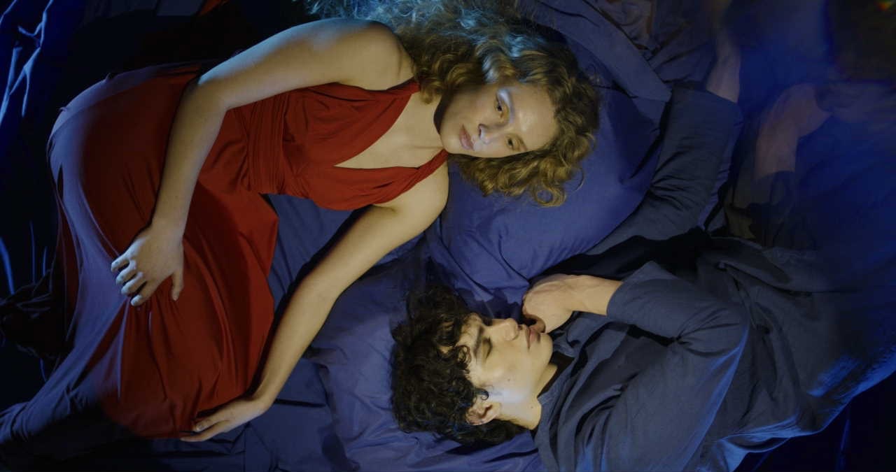Drama scene lit in red and blue — Random Acts, Channel 4, cinematography by Keith Ingram