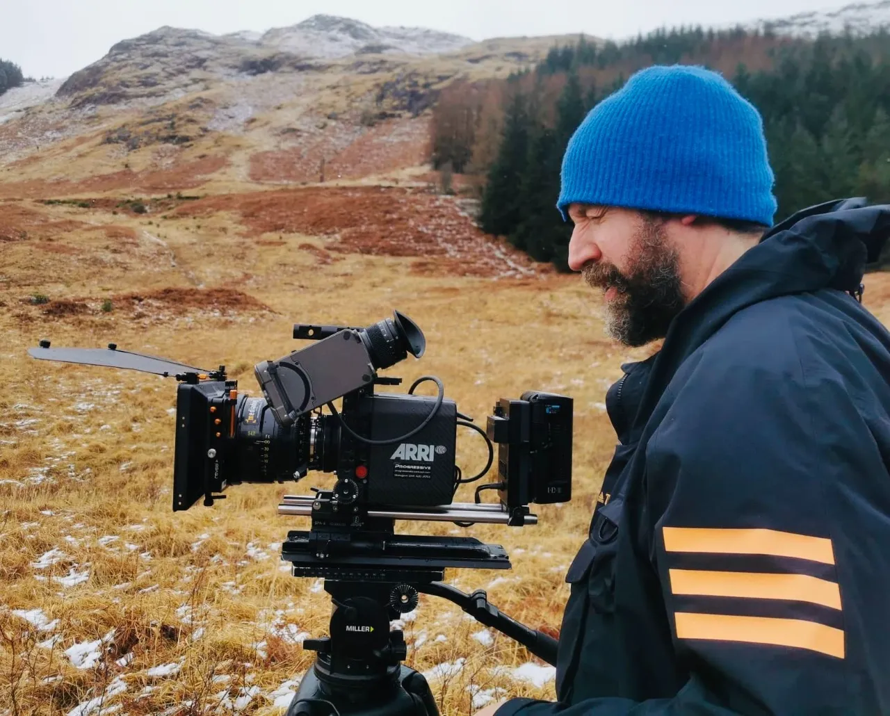 Keith Ingram operating a cinema camera on location