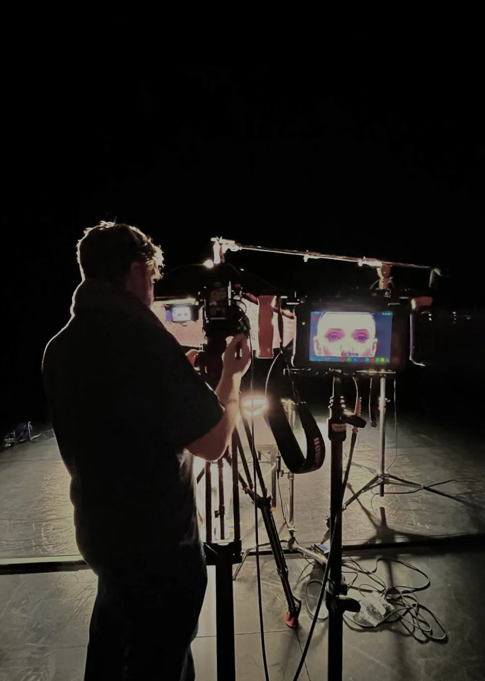 Keith Ingram at camera on a black stage, close-up on the monitor, Royal Ballet