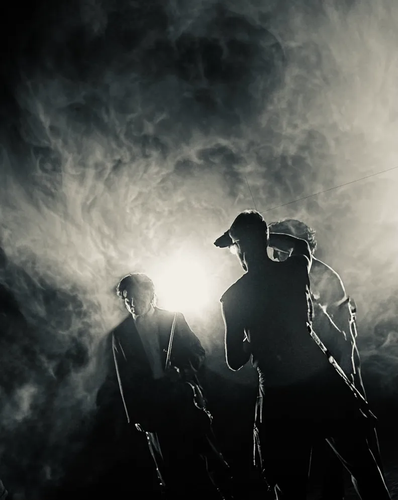 Vasko Vassilev, Steven McRae and Loughlan Prior silhouetted in haze, Royal Ballet shoot